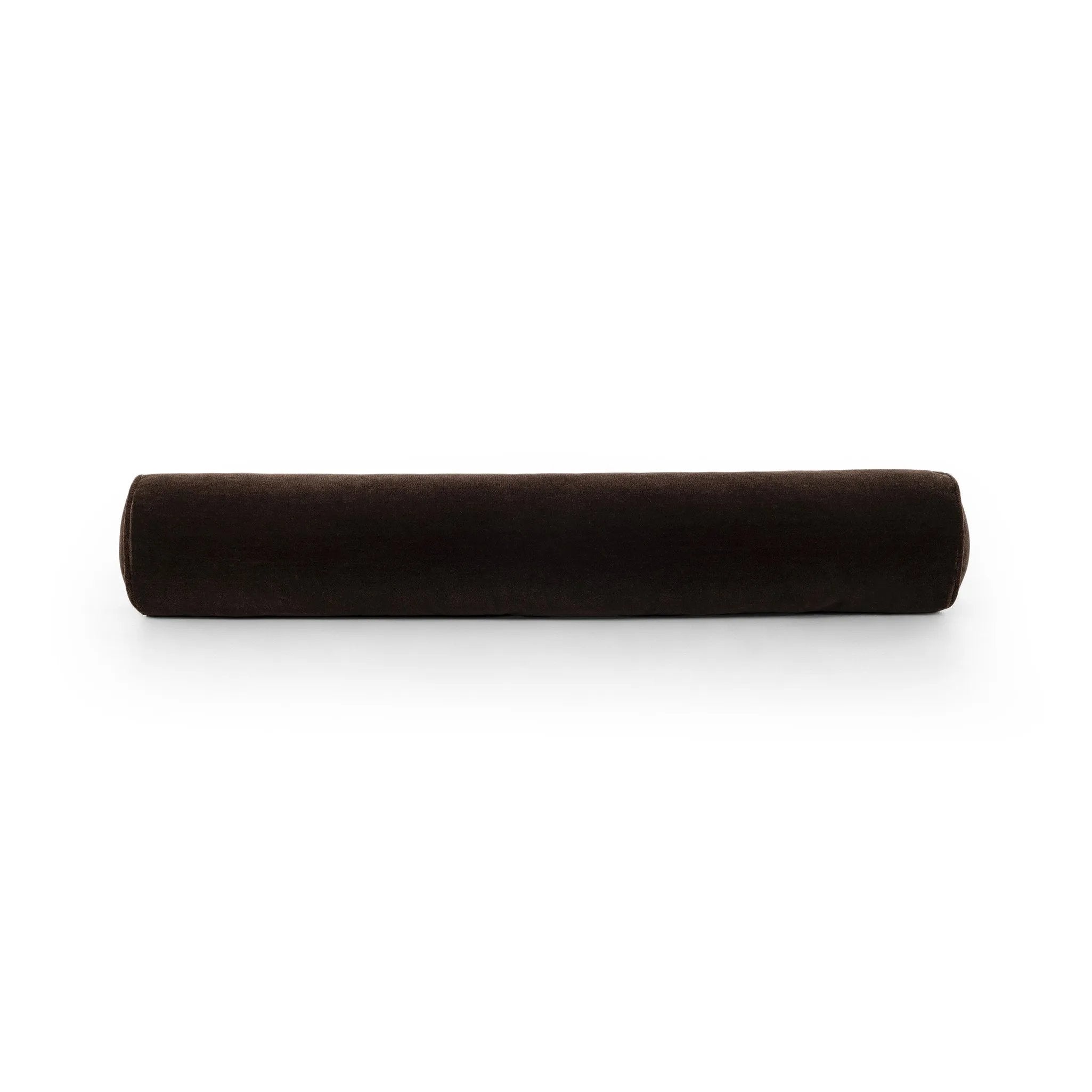 A long, chocolate-colored bolster pillow elevates beds and sofas in an instant. Crafted from saturated wool velvet, for a sustainable alternative to mohair, with a hidden zipper for a smooth silhouette Amethyst Home provides interior design, new home construction design consulting, vintage area rugs, and lighting in the Kansas City metro area.