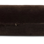 A long, chocolate-colored bolster pillow elevates beds and sofas in an instant. Crafted from saturated wool velvet, for a sustainable alternative to mohair, with a hidden zipper for a smooth silhouette Amethyst Home provides interior design, new home construction design consulting, vintage area rugs, and lighting in the Monterey metro area.