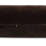 A long, chocolate-colored bolster pillow elevates beds and sofas in an instant. Crafted from saturated wool velvet, for a sustainable alternative to mohair, with a hidden zipper for a smooth silhouette Amethyst Home provides interior design, new home construction design consulting, vintage area rugs, and lighting in the Monterey metro area.