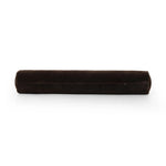 A long, chocolate-colored bolster pillow elevates beds and sofas in an instant. Crafted from saturated wool velvet, for a sustainable alternative to mohair, with a hidden zipper for a smooth silhouette Amethyst Home provides interior design, new home construction design consulting, vintage area rugs, and lighting in the San Diego metro area.
