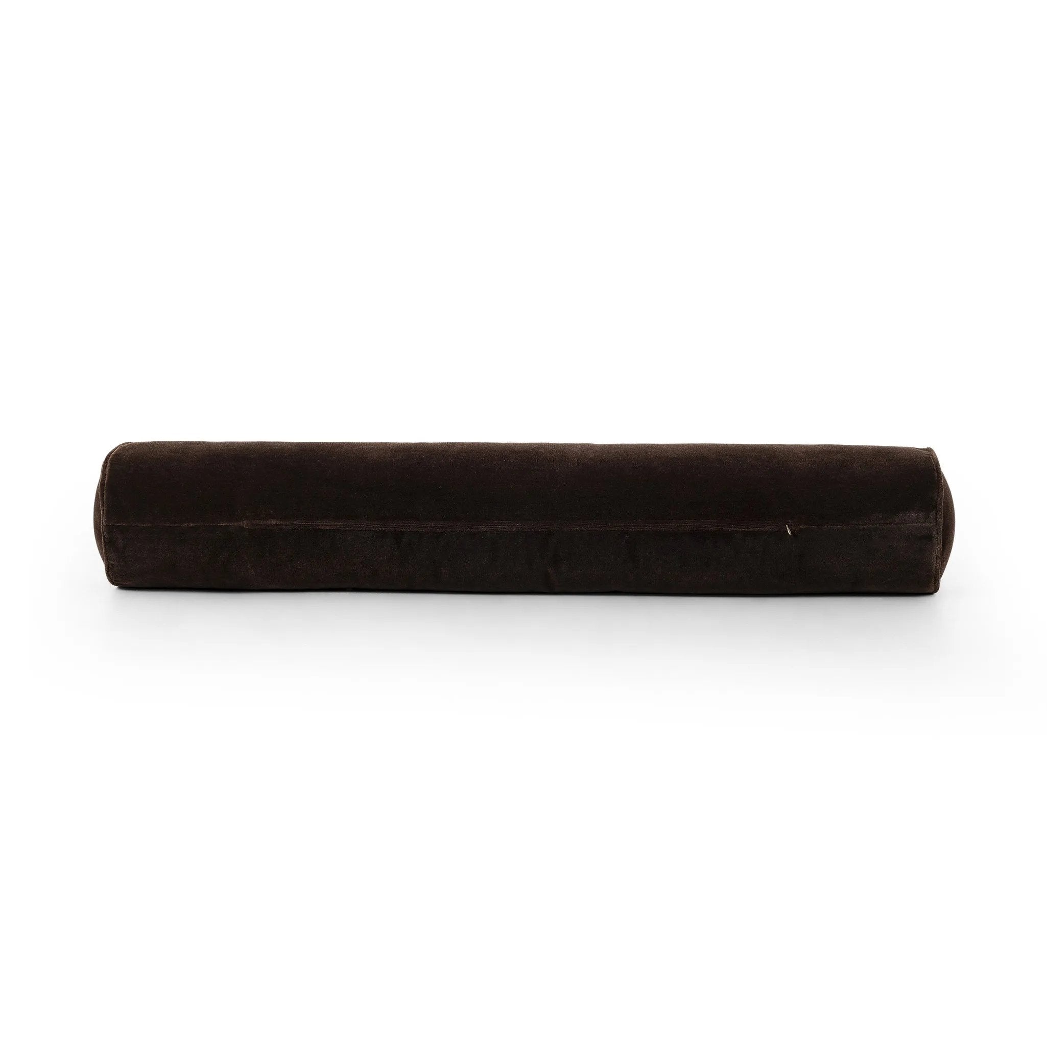 A long, chocolate-colored bolster pillow elevates beds and sofas in an instant. Crafted from saturated wool velvet, for a sustainable alternative to mohair, with a hidden zipper for a smooth silhouette Amethyst Home provides interior design, new home construction design consulting, vintage area rugs, and lighting in the San Diego metro area.