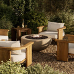This outdoor fire table is a welcoming centerpiece designed for gathering. Made from glass-reinforced concrete, each piece is naturally finished with subtle tones of grey and cream. The bowl shape is completed with lavastones in the center, bringing together a bold, monochromatic look. Amethyst Home provides interior design, new home construction design consulting, vintage area rugs, and lighting in the Charlotte metro area.
