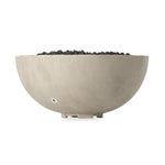 This outdoor fire table is a welcoming centerpiece designed for gathering. Made from glass-reinforced concrete, each piece is naturally finished with subtle tones of grey and cream. The bowl shape is completed with lavastones in the center, bringing together a bold, monochromatic look. Amethyst Home provides interior design, new home construction design consulting, vintage area rugs, and lighting in the Miami metro area.