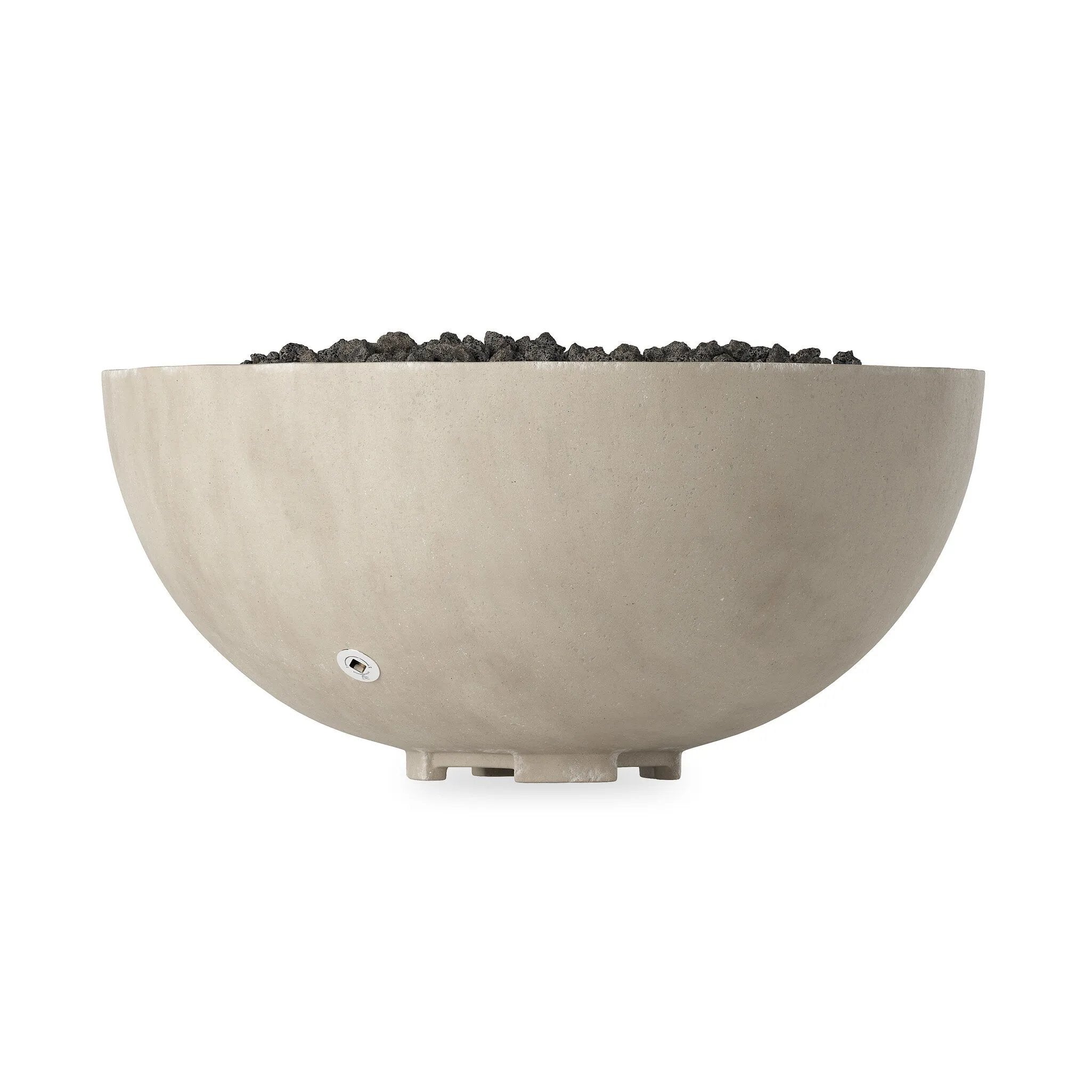 This outdoor fire table is a welcoming centerpiece designed for gathering. Made from glass-reinforced concrete, each piece is naturally finished with subtle tones of grey and cream. The bowl shape is completed with lavastones in the center, bringing together a bold, monochromatic look. Amethyst Home provides interior design, new home construction design consulting, vintage area rugs, and lighting in the Miami metro area.