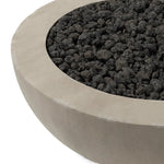 This outdoor fire table is a welcoming centerpiece designed for gathering. Made from glass-reinforced concrete, each piece is naturally finished with subtle tones of grey and cream. The bowl shape is completed with lavastones in the center, bringing together a bold, monochromatic look. Amethyst Home provides interior design, new home construction design consulting, vintage area rugs, and lighting in the San Diego metro area.