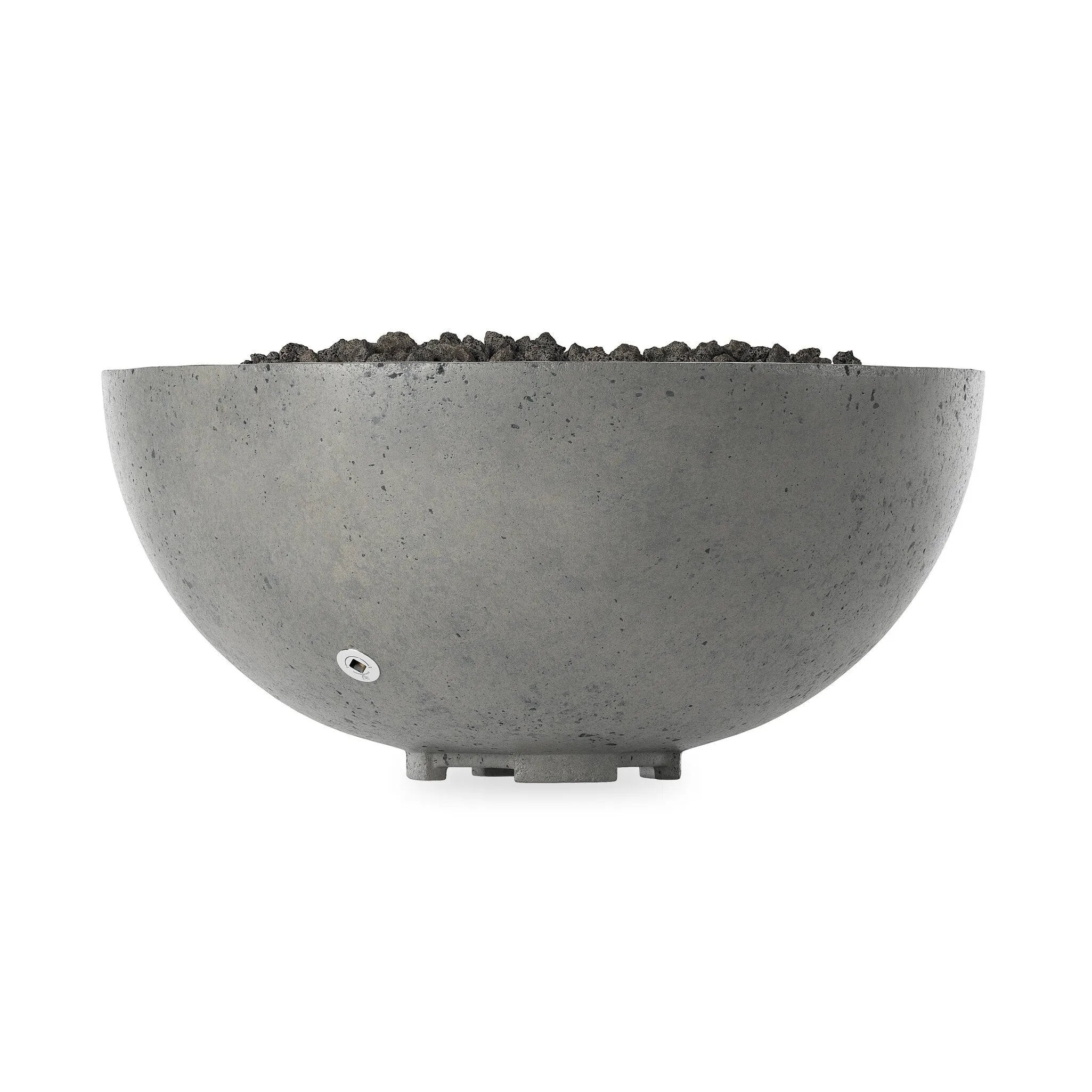 This outdoor fire table is a welcoming centerpiece designed for gathering. Made from glass-reinforced concrete, each piece is naturally finished with deep tones of pewter and dark grey. The bowl shape is completed with lavastones in the center, bringing together a bold, monochromatic look. Amethyst Home provides interior design, new home construction design consulting, vintage area rugs, and lighting in the Des Moines metro area.