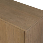The traditional media console, reimagined. This warm oak piece features two sets of doors with shallow scalloping that draws the eye, providing a subtle visual flow. Rear cutouts for cord management.As lovers of natural aesthetics at Amethyst, we love the designer inspired Brookhurst Media Console - Drifted Oak Veneer. Amethyst Home provides interior design, new home construction design consulting, vintage area rugs, and lighting in the Austin metro area.