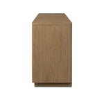 The traditional media console, reimagined. This warm oak piece features two sets of doors with shallow scalloping that draws the eye, providing a subtle visual flow. Rear cutouts for cord management.As lovers of natural aesthetics at Amethyst, we love the designer inspired Brookhurst Media Console - Drifted Oak Veneer. Amethyst Home provides interior design, new home construction design consulting, vintage area rugs, and lighting in the Houston metro area.