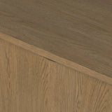 The traditional media console, reimagined. This warm oak piece features two sets of doors with shallow scalloping that draws the eye, providing a subtle visual flow. Rear cutouts for cord management.As lovers of natural aesthetics at Amethyst, we love the designer inspired Brookhurst Media Console - Drifted Oak Veneer. Amethyst Home provides interior design, new home construction design consulting, vintage area rugs, and lighting in the Laguna Beach metro area.
