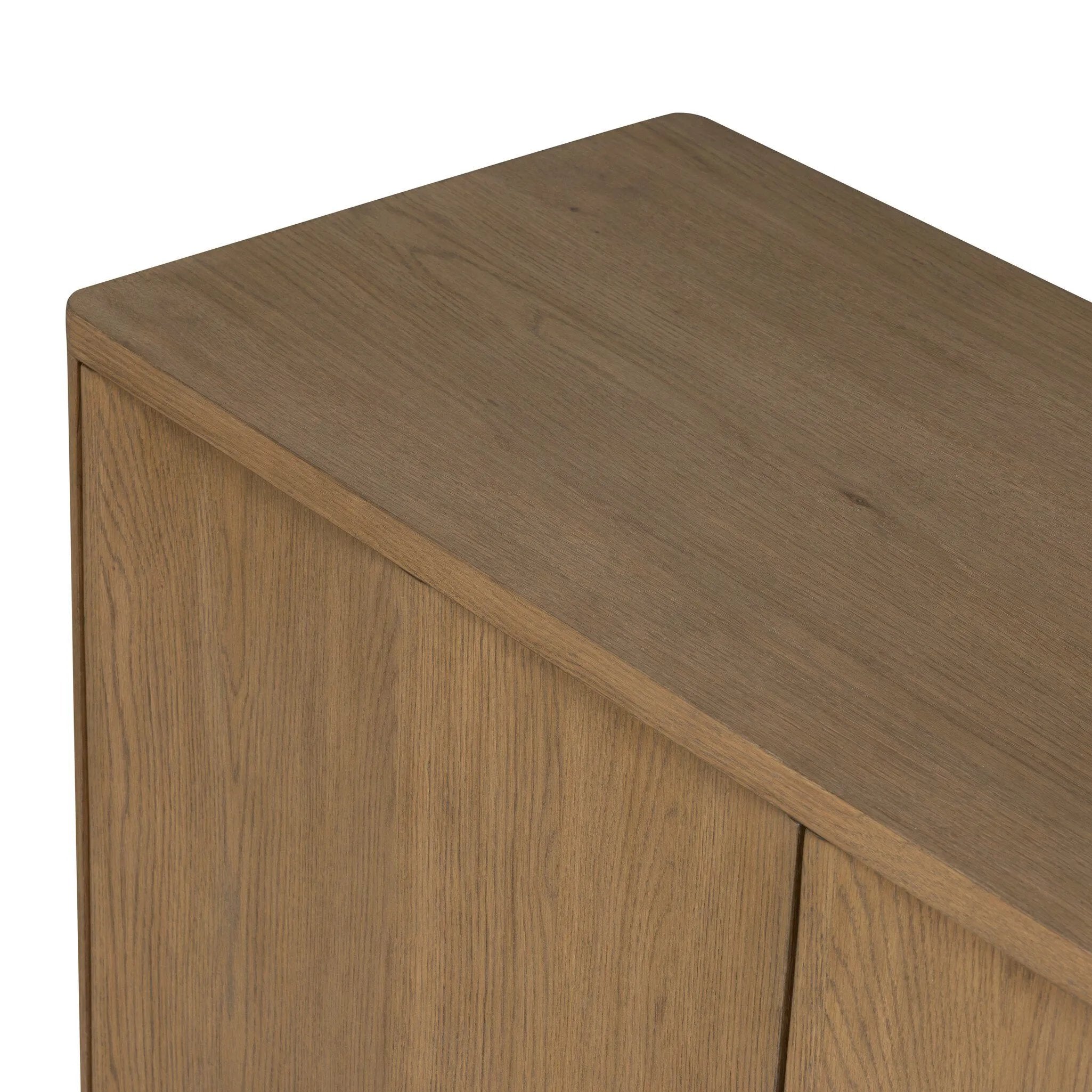 The traditional media console, reimagined. This warm oak piece features two sets of doors with shallow scalloping that draws the eye, providing a subtle visual flow. Rear cutouts for cord management.As lovers of natural aesthetics at Amethyst, we love the designer inspired Brookhurst Media Console - Drifted Oak Veneer. Amethyst Home provides interior design, new home construction design consulting, vintage area rugs, and lighting in the Miami metro area.