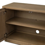 The traditional media console, reimagined. This warm oak piece features two sets of doors with shallow scalloping that draws the eye, providing a subtle visual flow. Rear cutouts for cord management.As lovers of natural aesthetics at Amethyst, we love the designer inspired Brookhurst Media Console - Drifted Oak Veneer. Amethyst Home provides interior design, new home construction design consulting, vintage area rugs, and lighting in the Park City metro area.
