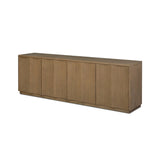 The traditional media console, reimagined. This warm oak piece features two sets of doors with shallow scalloping that draws the eye, providing a subtle visual flow. Rear cutouts for cord management.As lovers of natural aesthetics at Amethyst, we love the designer inspired Brookhurst Media Console - Drifted Oak Veneer. Amethyst Home provides interior design, new home construction design consulting, vintage area rugs, and lighting in the Washington metro area.