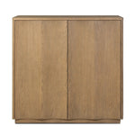 The classic wooden cabinet, reimagined. This warm oak piece features double doors with shallow scalloping that draws the eye, providing a subtle visual flow.As lovers of wabi sabi design at Amethyst, we love the designer inspired Brookhurst Small Cabinet - Drifted Oak Veneer. Amethyst Home provides interior design, new home construction design consulting, vintage area rugs, and lighting in the Salt Lake City metro area.