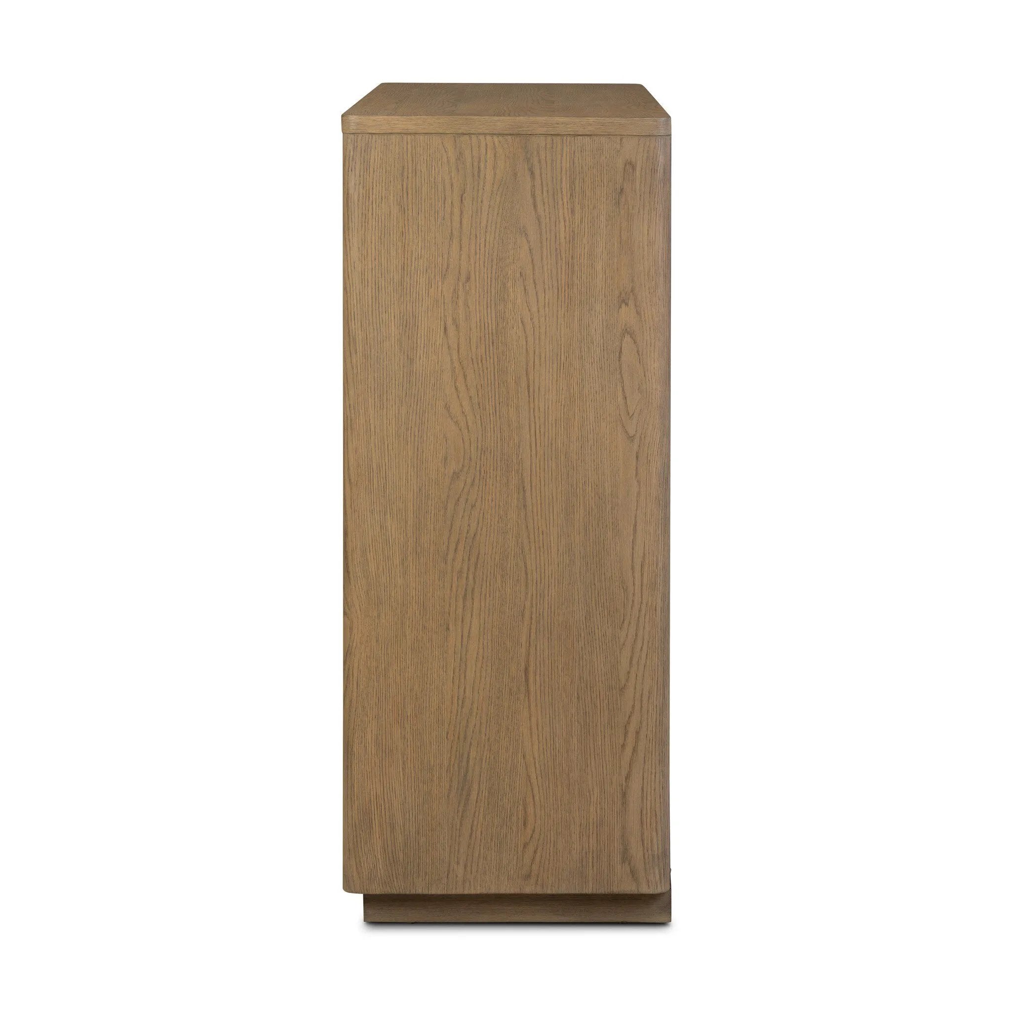 The classic wooden cabinet, reimagined. This warm oak piece features double doors with shallow scalloping that draws the eye, providing a subtle visual flow.As lovers of wabi sabi design at Amethyst, we love the designer inspired Brookhurst Small Cabinet - Drifted Oak Veneer. Amethyst Home provides interior design, new home construction design consulting, vintage area rugs, and lighting in the Seattle metro area.