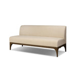 This timeless piece works seamlessly into a wide range of styles and collections. With tapered wooden legs with a small curve detail and an armless silhouette for ease and flexibility around a dining banquette. Upholstered in a beautifully neutral performance fabric, connected with alligator clips at the bottom. Amethyst Home provides interior design, new home construction design consulting, vintage area rugs, and lighting in the Nashville metro area.