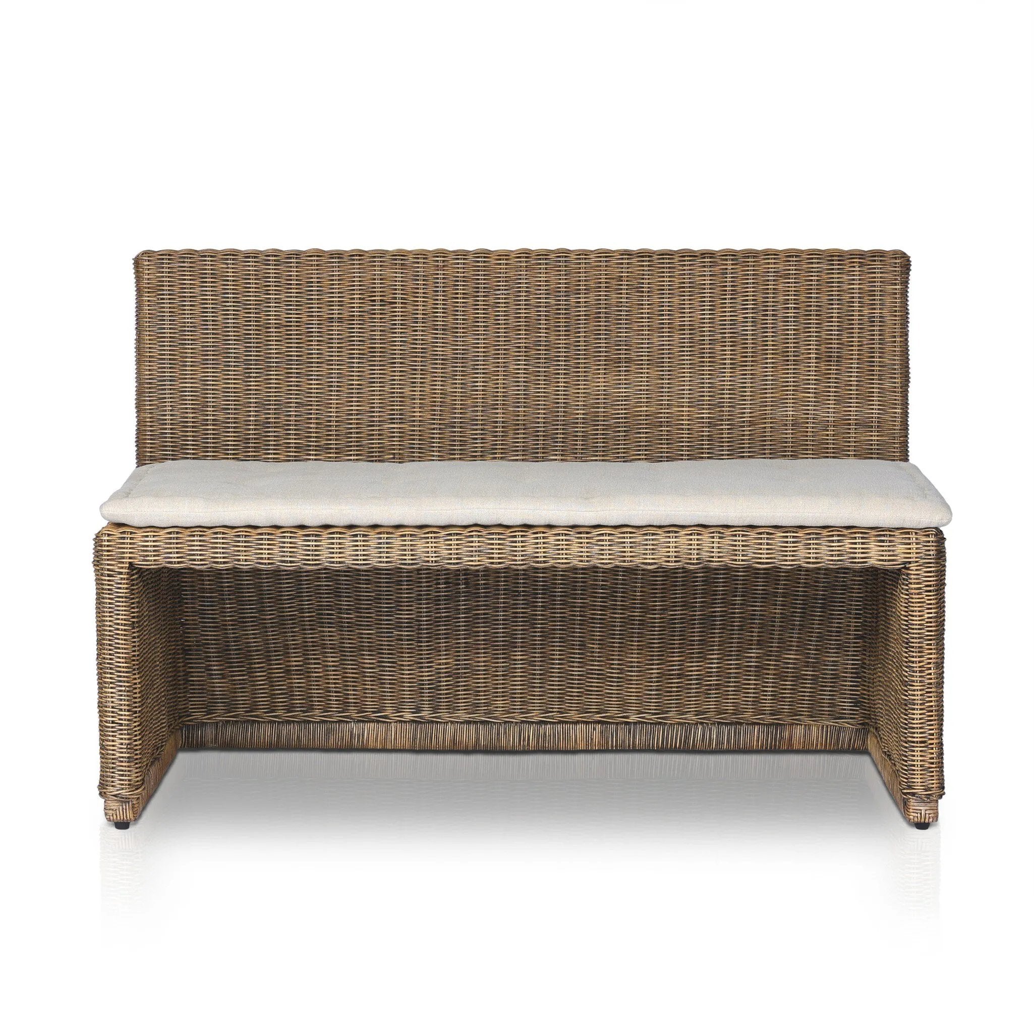 Antique-inspired coastal style. Rattan introduces varying natural shades and texture to this dining bench, and the frame's soft lines and fabric cushion invite a comfortable sit. Option to style alone or pair with other pieces in the collection. A design collaboration by Amber Lewis and Four Hands. Winner of the Domino Good Design Awards 2024. Amethyst Home provides interior design, new home construction design consulting, vintage area rugs, and lighting in the San Diego metro area.