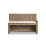 Antique-inspired coastal style. Rattan introduces varying natural shades and texture to this dining bench, and the frame's soft lines and fabric cushion invite a comfortable sit. Option to style alone or pair with other pieces in the collection. A design collaboration by Amber Lewis and Four Hands. Winner of the Domino Good Design Awards 2024. Amethyst Home provides interior design, new home construction design consulting, vintage area rugs, and lighting in the Scottsdale metro area.