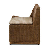 Antique-inspired coastal style. Rattan introduces varying natural shades and texture to this dining bench, and the frame's soft lines and beige and white striped fabric cushion invite a comfortable sit. Option to style alone or pair with other pieces in the collection. A design collaboration by Amber Lewis and Four Hands. Amethyst Home provides interior design, new home construction design consulting, vintage area rugs, and lighting in the Charlotte metro area.