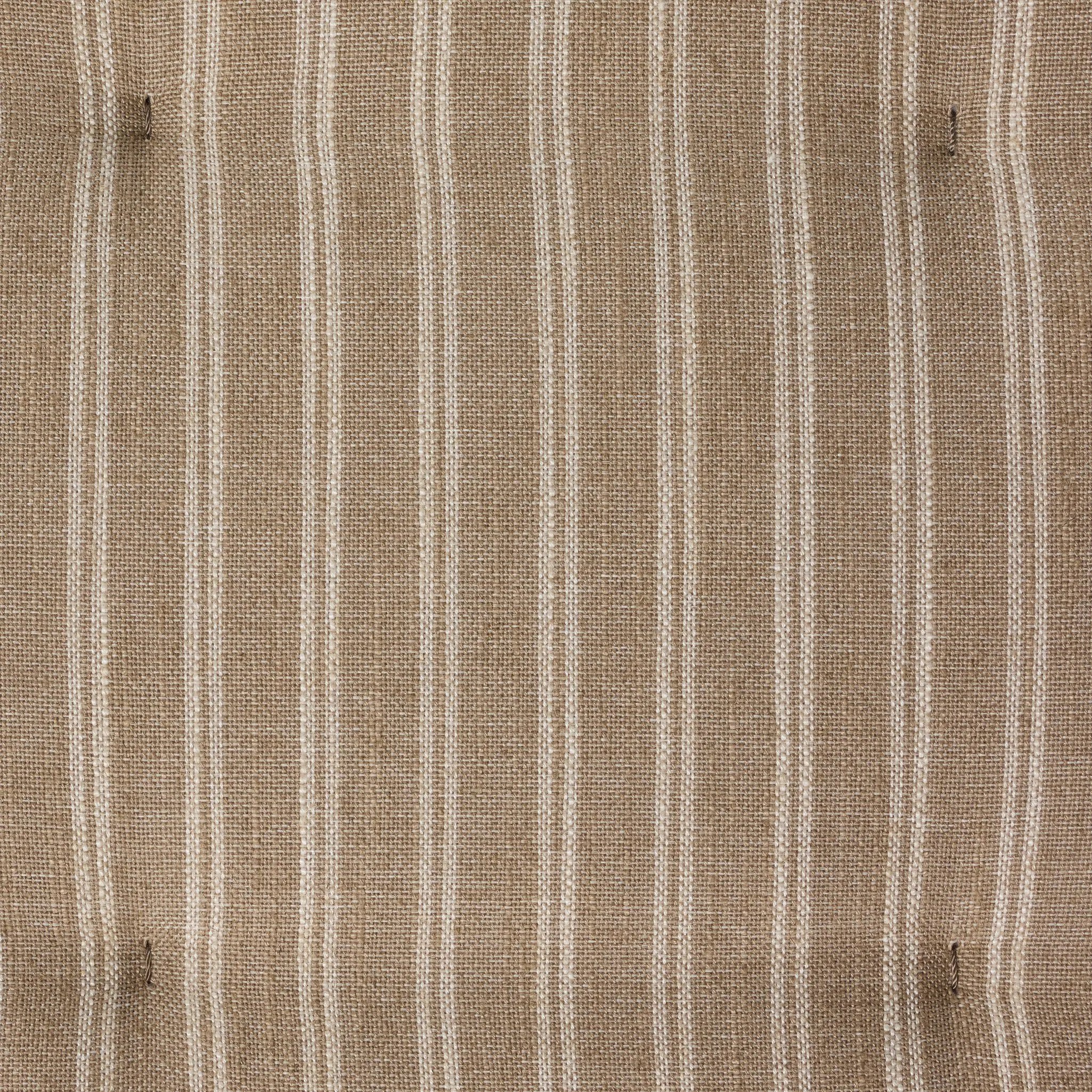 Antique-inspired coastal style. Rattan introduces varying natural shades and texture to this dining bench, and the frame's soft lines and beige and white striped fabric cushion invite a comfortable sit. Option to style alone or pair with other pieces in the collection. A design collaboration by Amber Lewis and Four Hands. Amethyst Home provides interior design, new home construction design consulting, vintage area rugs, and lighting in the Omaha metro area.