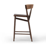 Featuring Buxton Natural Paper Rush Bar + Counter Stool by Four Hands at Amethyst Home. A solid oak counter stool defined by tapered legs and framing gives an updated look to the classic whistler chair. Finished with a paper rush wrapped detail on the back.BarOverall Dimensions: 19.25"w x 22.25"d x 42.75"hWeight: 23.70 lbsCounterOverall Dimensions: 19.50"w . Amethyst Home provides interior design, new home construction design consulting, vintage area rugs, and lighting in the Calabasas metro area.