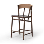 Featuring Buxton Natural Paper Rush Bar + Counter Stool by Four Hands at Amethyst Home. A solid oak counter stool defined by tapered legs and framing gives an updated look to the classic whistler chair. Finished with a paper rush wrapped detail on the back.BarOverall Dimensions: 19.25"w x 22.25"d x 42.75"hWeight: 23.70 lbsCounterOverall Dimensions: 19.50"w x 22. Amethyst Home provides interior design, new home construction design consulting, vintage area rugs, and lighting in the Omaha metro area.