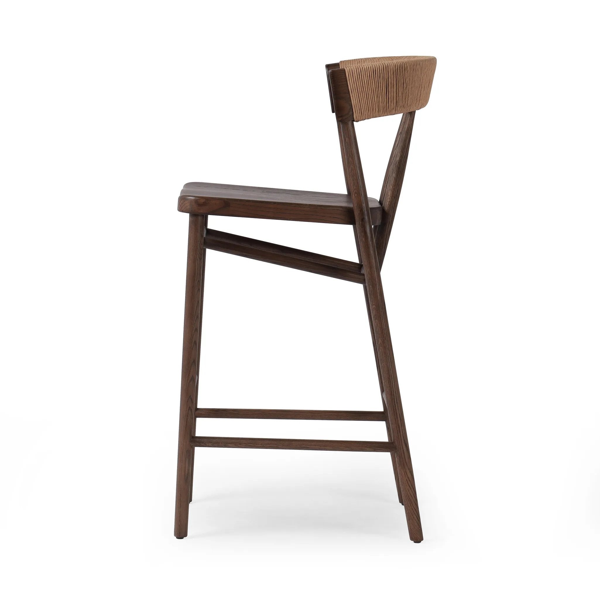 Featuring Buxton Natural Paper Rush Bar + Counter Stool by Four Hands at Amethyst Home. A solid oak counter stool defined by tapered legs and framing gives an updated look to the classic whistler chair. Finished with a paper rush wrapped detail on the back.BarOverall Dimensions: 19.25"w x 22.25"d x 42.75"hWeight: 23.70 lbsCounterOverall Dimensions: 19.. Amethyst Home provides interior design, new home construction design consulting, vintage area rugs, and lighting in the Salt Lake City metro area.