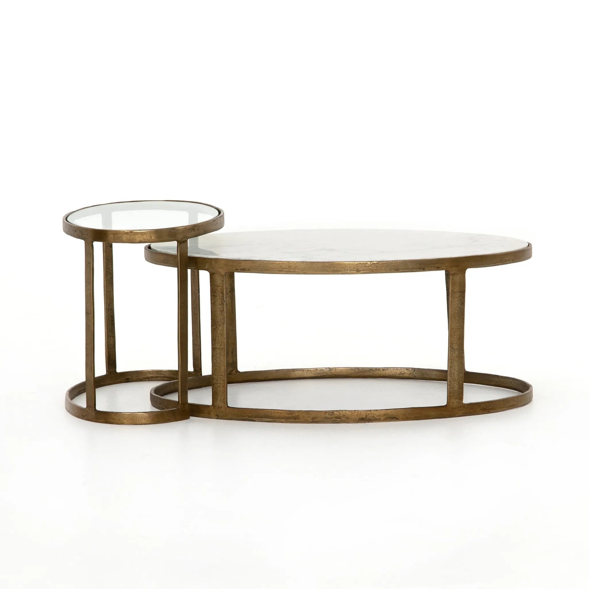 Shapely surfaces, designed to slide together or apart with ease. A raw brass finish lends a lived-in feel to aluminum framing, with one oval-shaped nester topped by polished white marble pairing with a taller, rounded table featuring tempered glass.    Large Table: 38.00"w x 24.00"d x 15.50"h  Small Table: 23.25"w x 15.75"d x 18.75" Amethyst Home provides interior design, new home construction design consulting, vintage area rugs, and lighting in the Tampa metro area.