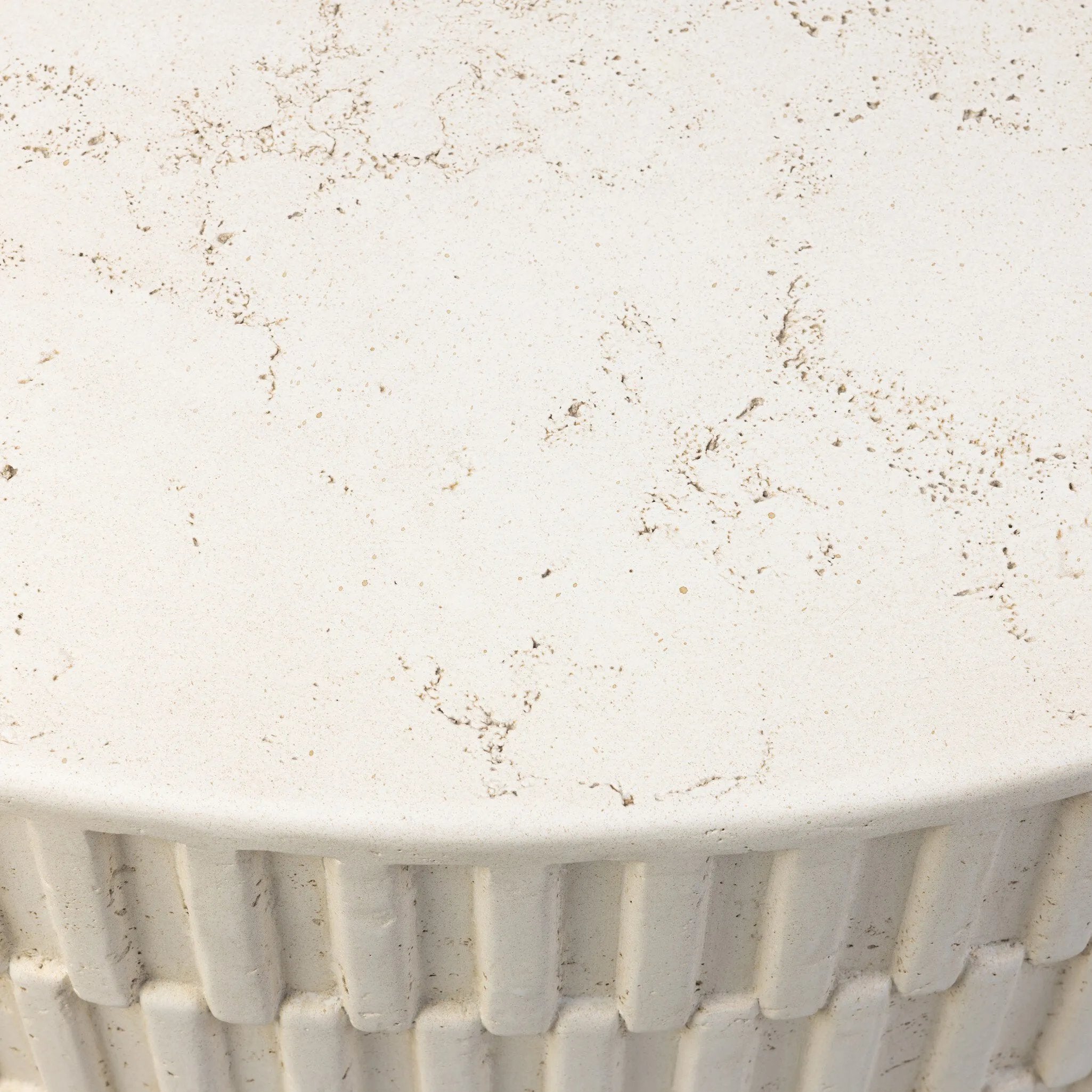 Cast concrete shapes a drum-style outdoor coffee table, with a linear pattern layered for added texture. Finished with a parchment-like textural feel. Cover or store inside during inclement weather and when not in use.As lovers of wabi sabi design at Amethyst, we love the warm modern inspired Callisto Outdoor Coffee Table - Aged White Concrete. Amethyst Home provides interior design, new home construction design consulting, vintage area rugs, and lighting in the Alpharetta metro area.