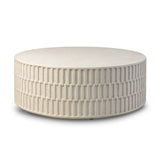 Cast concrete shapes a drum-style outdoor coffee table, with a linear pattern layered for added texture. Finished with a parchment-like textural feel. Cover or store inside during inclement weather and when not in use.As lovers of wabi sabi design at Amethyst, we love the warm modern inspired Callisto Outdoor Coffee Table - Aged White Concrete. Amethyst Home provides interior design, new home construction design consulting, vintage area rugs, and lighting in the Kansas City metro area.