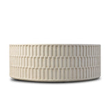 Cast concrete shapes a drum-style outdoor coffee table, with a linear pattern layered for added texture. Finished with a parchment-like textural feel. Cover or store inside during inclement weather and when not in use.As lovers of wabi sabi design at Amethyst, we love the warm modern inspired Callisto Outdoor Coffee Table - Aged White Concrete. Amethyst Home provides interior design, new home construction design consulting, vintage area rugs, and lighting in the Park City metro area.