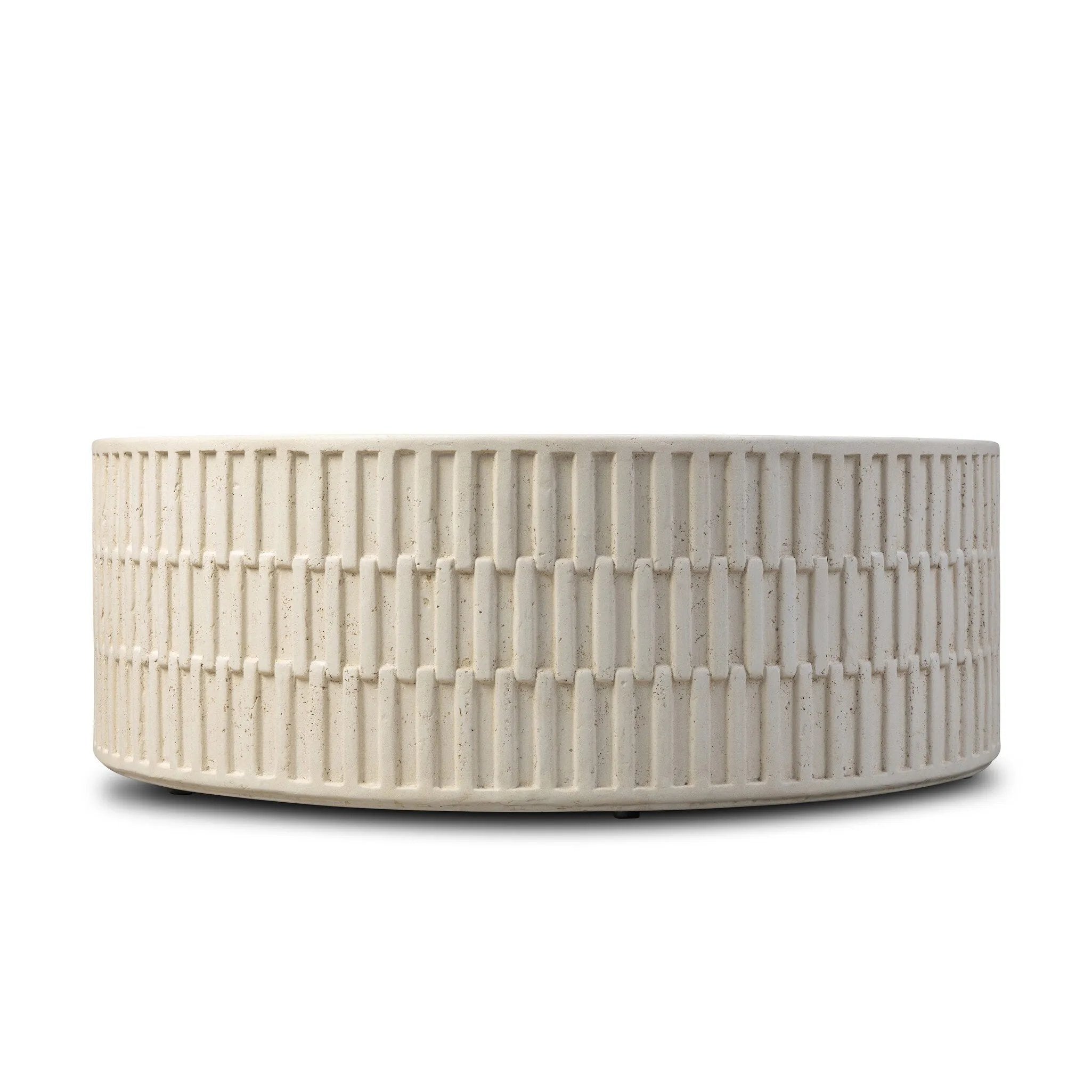 Cast concrete shapes a drum-style outdoor coffee table, with a linear pattern layered for added texture. Finished with a parchment-like textural feel. Cover or store inside during inclement weather and when not in use.As lovers of wabi sabi design at Amethyst, we love the warm modern inspired Callisto Outdoor Coffee Table - Aged White Concrete. Amethyst Home provides interior design, new home construction design consulting, vintage area rugs, and lighting in the Park City metro area.