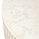 Cast concrete shapes a drum-style outdoor coffee table, with a linear pattern layered for added texture. Finished with a parchment-like textural feel. Cover or store inside during inclement weather and when not in use.As lovers of wabi sabi design at Amethyst, we love the warm modern inspired Callisto Outdoor Coffee Table - Aged White Concrete. Amethyst Home provides interior design, new home construction design consulting, vintage area rugs, and lighting in the Winter Garden metro area.