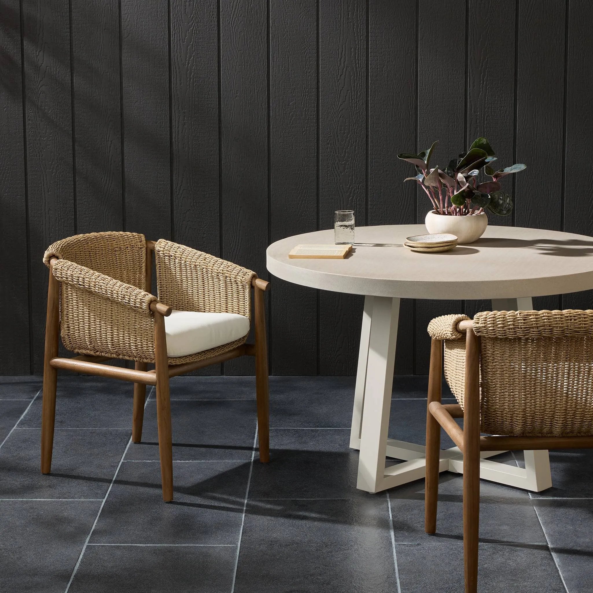 Bring home vintage inspiration. The sling shape of this outdoor dining chair features a reimagined bucket seat in woven faux hyacinth, finished with rounded tapered legs that mirror the shape of the frame. Cover or store indoors during inclement weather and when not in use Amethyst Home provides interior design, new home construction design consulting, vintage area rugs, and lighting in the Houston metro area.