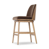 Solid ash wood forms a subtly curved back on this everyday counter stool. Its open frame and seat features rounded edges for 