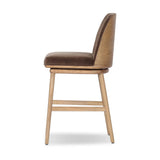 Solid ash wood forms a subtly curved back on this everyday counter stool. Its open frame and seat features rounded edges for 