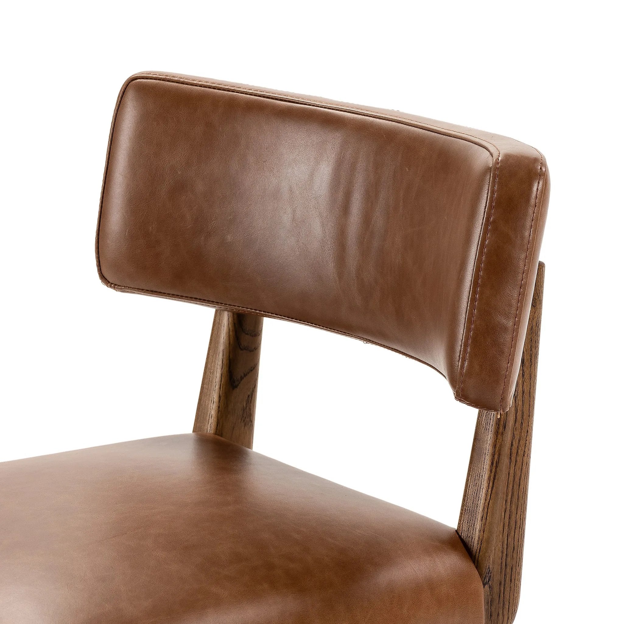 Featuring Cardell Sonoma Chestnut Swivel Bar + Counter Stool by Four Hands at Amethyst Home. This reimagined classic pairs a barrel back frame of solid nettlewood with top-grain leather in a rich chestnut. A 180-degree swivel with return memory tops off the piece with fresh functionality.BarOverall Dimensions: 21.50"w x 22.25"d x 42.50"hWeight: 24.25 lbsCou. Amethyst Home provides interior design, new home construction design consulting, vintage area rugs, and lighting in the Nashville metro area.