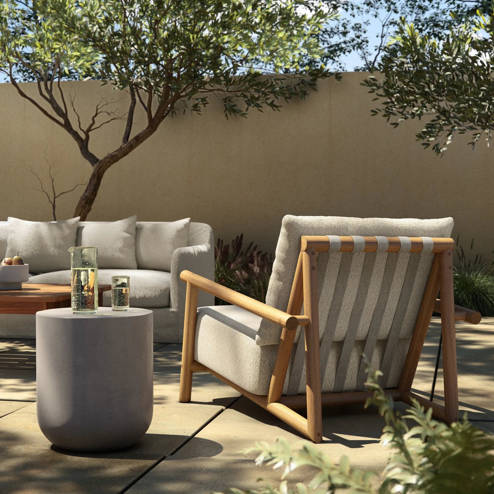 Featuring Cardiff Faye Sand Outdoor Chair by Four Hands at Amethyst Home. Angular FSC®-certified teak framing paired with softened dowel edges crafts a bench-made, transitional outdoor chair. Strap detailing supports the loose, knife-edge back cushion, complemented by a heavy fixed seat cushion — adding a touch of weight to the airy design. Cover or store ind. Amethyst Home provides interior design, new home construction design consulting, vintage area rugs, and lighting in the Houston metro area.
