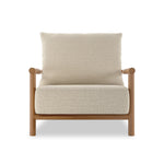 Featuring Cardiff Faye Sand Outdoor Chair by Four Hands at Amethyst Home. Angular FSC®-certified teak framing paired with softened dowel edges crafts a bench-made, transitional outdoor chair. Strap detailing supports the loose, knife-edge back cushion, complemented by a heavy fixed seat cushion — adding a touch of weight to the airy design. Cover or store indoo. Amethyst Home provides interior design, new home construction design consulting, vintage area rugs, and lighting in the Omaha metro area.