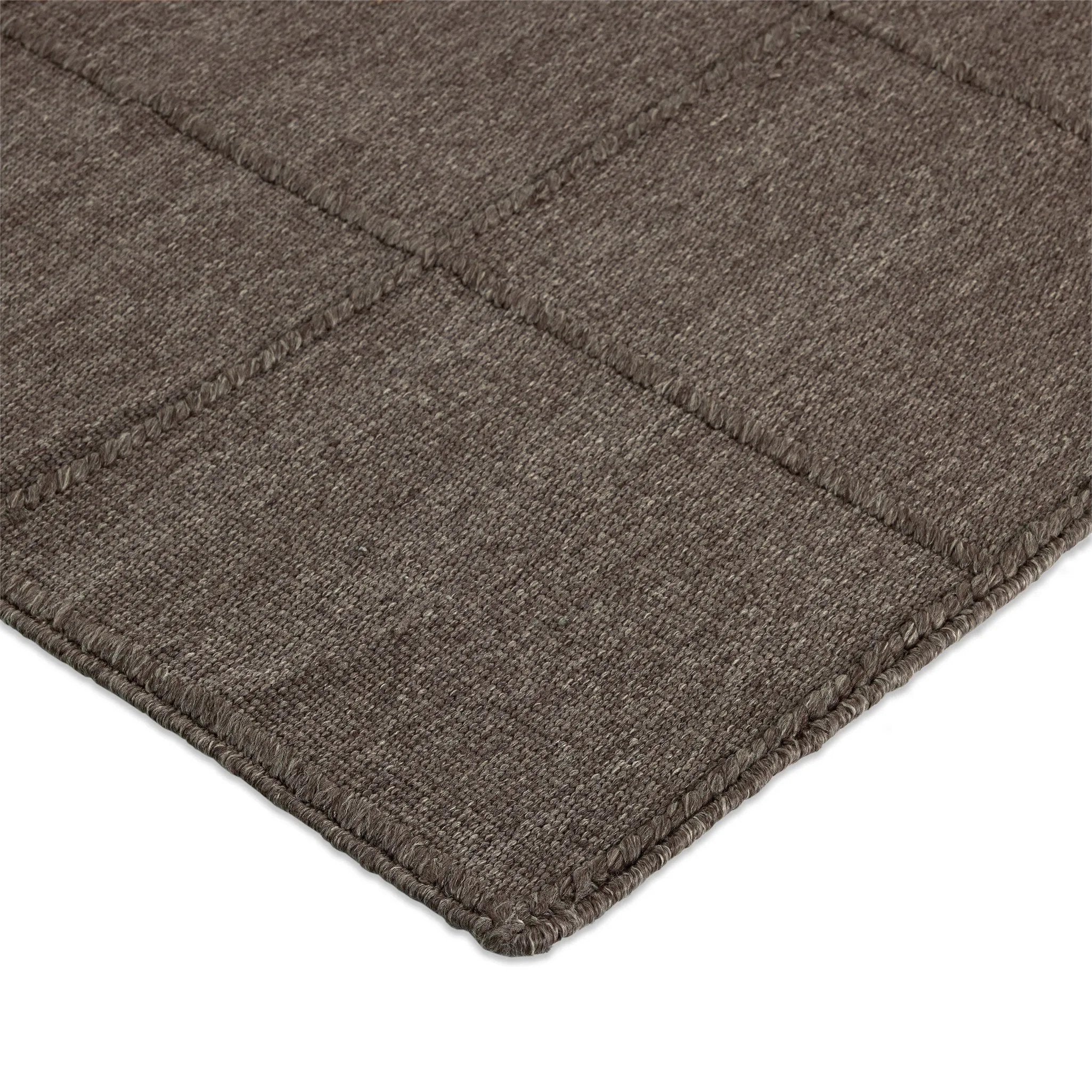 Hand woven in a flat weave grid pattern for the look of an indoor textile, this  mineral-hued rug grounds the outdoor lounge with a high-texture look. Slight variation in sizing and imperfect lines due to the handcrafted nature of each piece are to be expected. Store inside during inclement weather and when not in use. Amethyst Home provides interior design, new home construction design consulting, vintage area rugs, and lighting in the Alpharetta metro area.