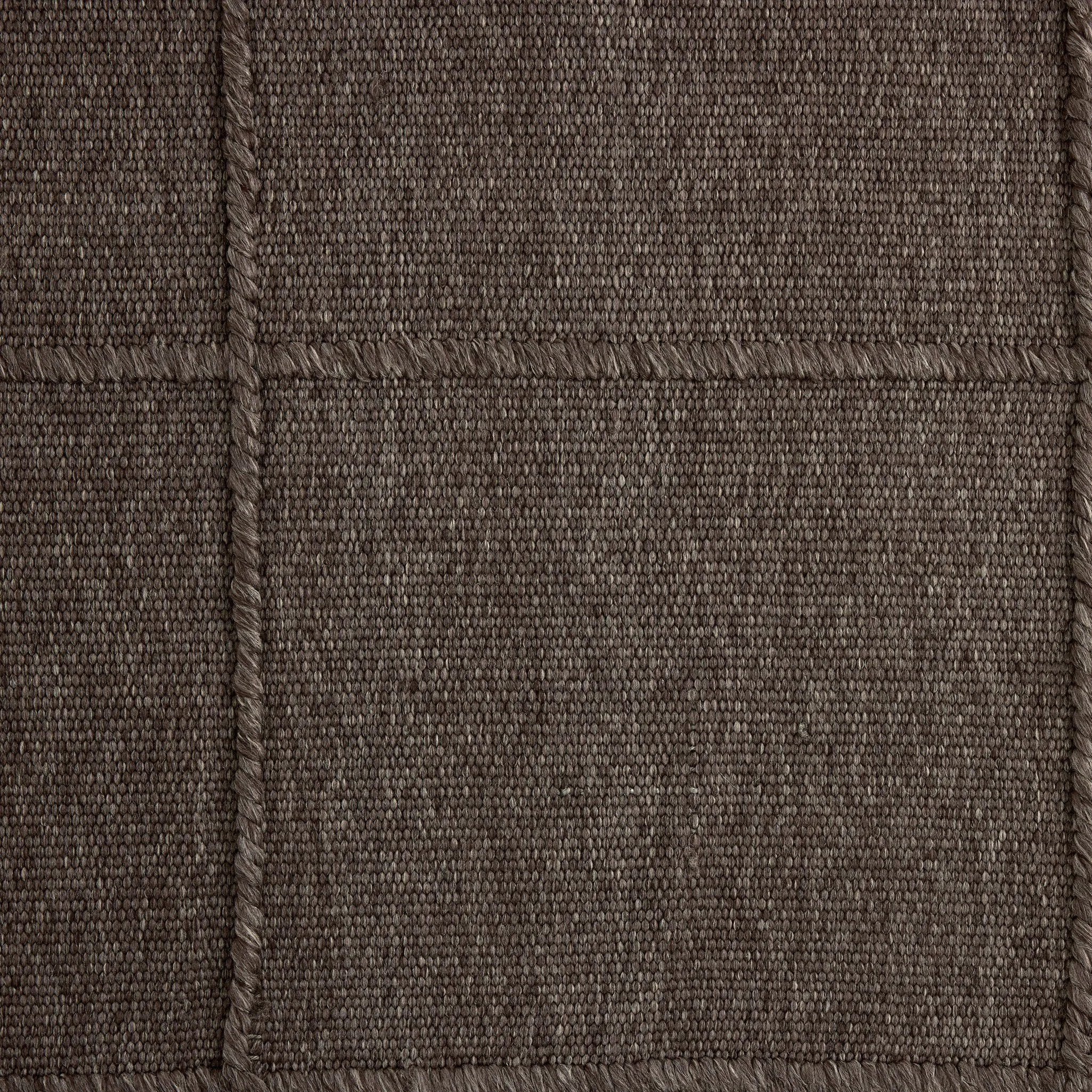Hand woven in a flat weave grid pattern for the look of an indoor textile, this  mineral-hued rug grounds the outdoor lounge with a high-texture look. Slight variation in sizing and imperfect lines due to the handcrafted nature of each piece are to be expected. Store inside during inclement weather and when not in use. Amethyst Home provides interior design, new home construction design consulting, vintage area rugs, and lighting in the Miami metro area.