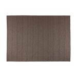 Hand woven in a flat weave grid pattern for the look of an indoor textile, this  mineral-hued rug grounds the outdoor lounge with a high-texture look. Slight variation in sizing and imperfect lines due to the handcrafted nature of each piece are to be expected. Store inside during inclement weather and when not in use. Amethyst Home provides interior design, new home construction design consulting, vintage area rugs, and lighting in the Newport Beach metro area.