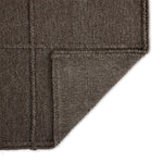 Hand woven in a flat weave grid pattern for the look of an indoor textile, this  mineral-hued rug grounds the outdoor lounge with a high-texture look. Slight variation in sizing and imperfect lines due to the handcrafted nature of each piece are to be expected. Store inside during inclement weather and when not in use. Amethyst Home provides interior design, new home construction design consulting, vintage area rugs, and lighting in the Park City metro area.