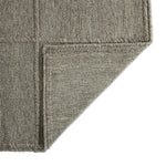 Hand woven in a flat weave grid pattern for the look of an indoor textile, this  silver-hued rug grounds the outdoor lounge with a high-texture look. Slight variation in sizing and imperfect lines due to the handcrafted nature of each piece are to be expected. Store inside during inclement weather and when not in use. Amethyst Home provides interior design, new home construction design consulting, vintage area rugs, and lighting in the Los Angeles metro area.
