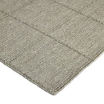 Hand woven in a flat weave grid pattern for the look of an indoor textile, this  silver-hued rug grounds the outdoor lounge with a high-texture look. Slight variation in sizing and imperfect lines due to the handcrafted nature of each piece are to be expected. Store inside during inclement weather and when not in use. Amethyst Home provides interior design, new home construction design consulting, vintage area rugs, and lighting in the Omaha metro area.