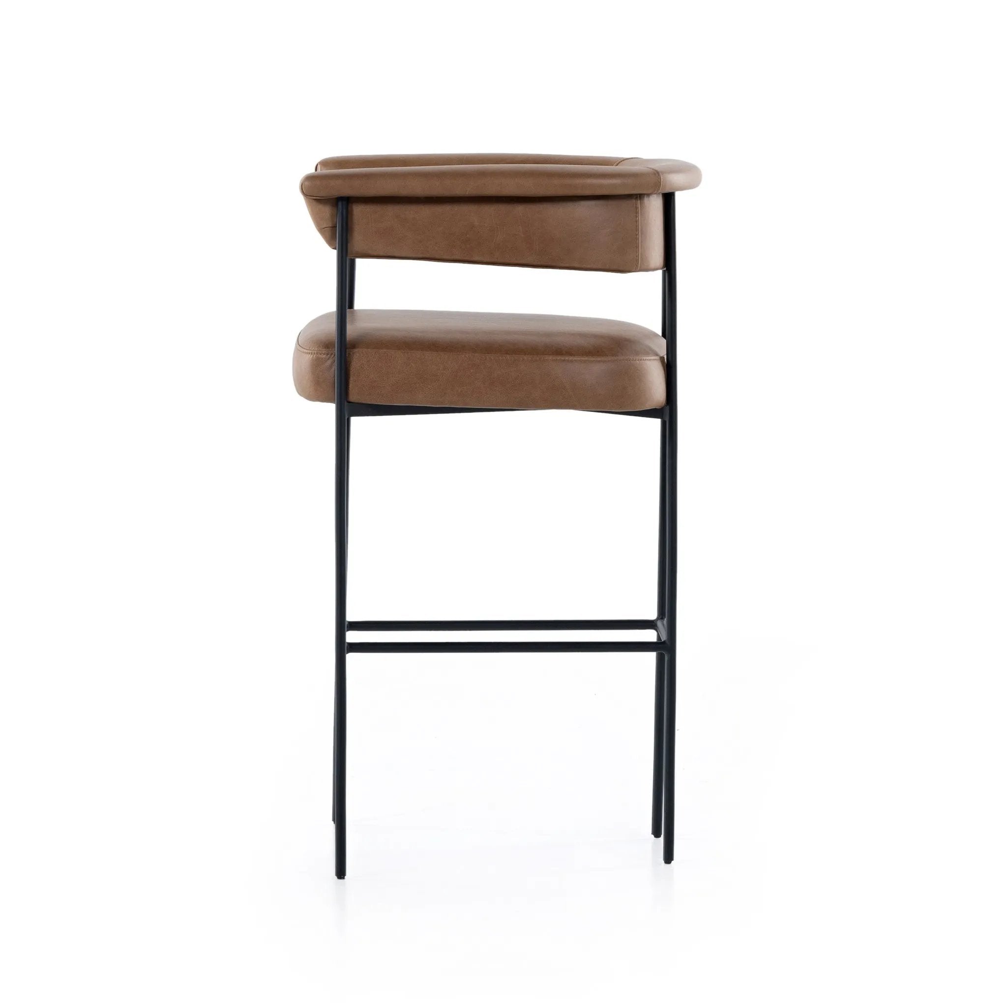 Featuring Carrie Chaps Saddle Bar + Counter Stool by Four Hands at Amethyst Home. Airy and light with slim, matte black-finished iron framing, tan top-grain leather lends sleekness to a beautifully sculpted counter style featuring a yoke back and exterior fold detailing.BarOverall Dimensions: 25.50"w x 23.00"d x 39.50"hWeight: 33.95 lbsCounterOverall Dimen. Amethyst Home provides interior design, new home construction design consulting, vintage area rugs, and lighting in the Des Moines metro area.