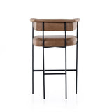 Featuring Carrie Chaps Saddle Bar + Counter Stool by Four Hands at Amethyst Home. Airy and light with slim, matte black-finished iron framing, tan top-grain leather lends sleekness to a beautifully sculpted counter style featuring a yoke back and exterior fold detailing.BarOverall Dimensions: 25.50"w x 23.00"d x 39.50"hWeight: 33.95 lbsCounterOverall Dimensio. Amethyst Home provides interior design, new home construction design consulting, vintage area rugs, and lighting in the Houston metro area.