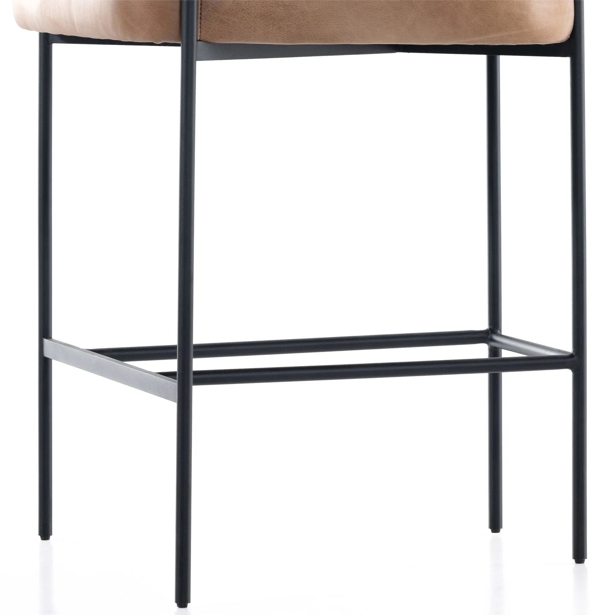 Featuring Carrie Chaps Saddle Bar + Counter Stool by Four Hands at Amethyst Home. Airy and light with slim, matte black-finished iron framing, tan top-grain leather lends sleekness to a beautifully sculpted counter style featuring a yoke back and exterior fold detailing.BarOverall Dimensions: 25.50"w x 23.00"d x 39.50"hWeight: 33.95 lbsCounterOverall Dimensi. Amethyst Home provides interior design, new home construction design consulting, vintage area rugs, and lighting in the Monterey metro area.