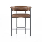 Featuring Carrie Chaps Saddle Bar + Counter Stool by Four Hands at Amethyst Home. Airy and light with slim, matte black-finished iron framing, tan top-grain leather lends sleekness to a beautifully sculpted counter style featuring a yoke back and exterior fold detailing.BarOverall Dimensions: 25.50"w x 23.00"d x 39.50"hWeight: 33.95 lbsCounterOverall Dimens. Amethyst Home provides interior design, new home construction design consulting, vintage area rugs, and lighting in the Nashville metro area.