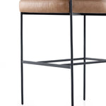 Featuring Carrie Chaps Saddle Bar + Counter Stool by Four Hands at Amethyst Home. Airy and light with slim, matte black-finished iron framing, tan top-grain leather lends sleekness to a beautifully sculpted counter style featuring a yoke back and exterior fold detailing.BarOverall Dimensions: 25.50"w x 23.00"d x 39.50"hWeight: 33.95 lbsCounterOverall Dimens. Amethyst Home provides interior design, new home construction design consulting, vintage area rugs, and lighting in the Park City metro area.