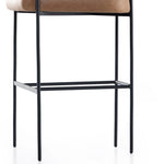 Featuring Carrie Chaps Saddle Bar + Counter Stool by Four Hands at Amethyst Home. Airy and light with slim, matte black-finished iron framing, tan top-grain leather lends sleekness to a beautifully sculpted counter style featuring a yoke back and exterior fold detailing.BarOverall Dimensions: 25.50"w x 23.00"d x 39.50"hWeight: 33.95 lbsCounterOverall Dimensi. Amethyst Home provides interior design, new home construction design consulting, vintage area rugs, and lighting in the Portland metro area.